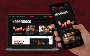 A smartphone and laptop display a restaurant's 