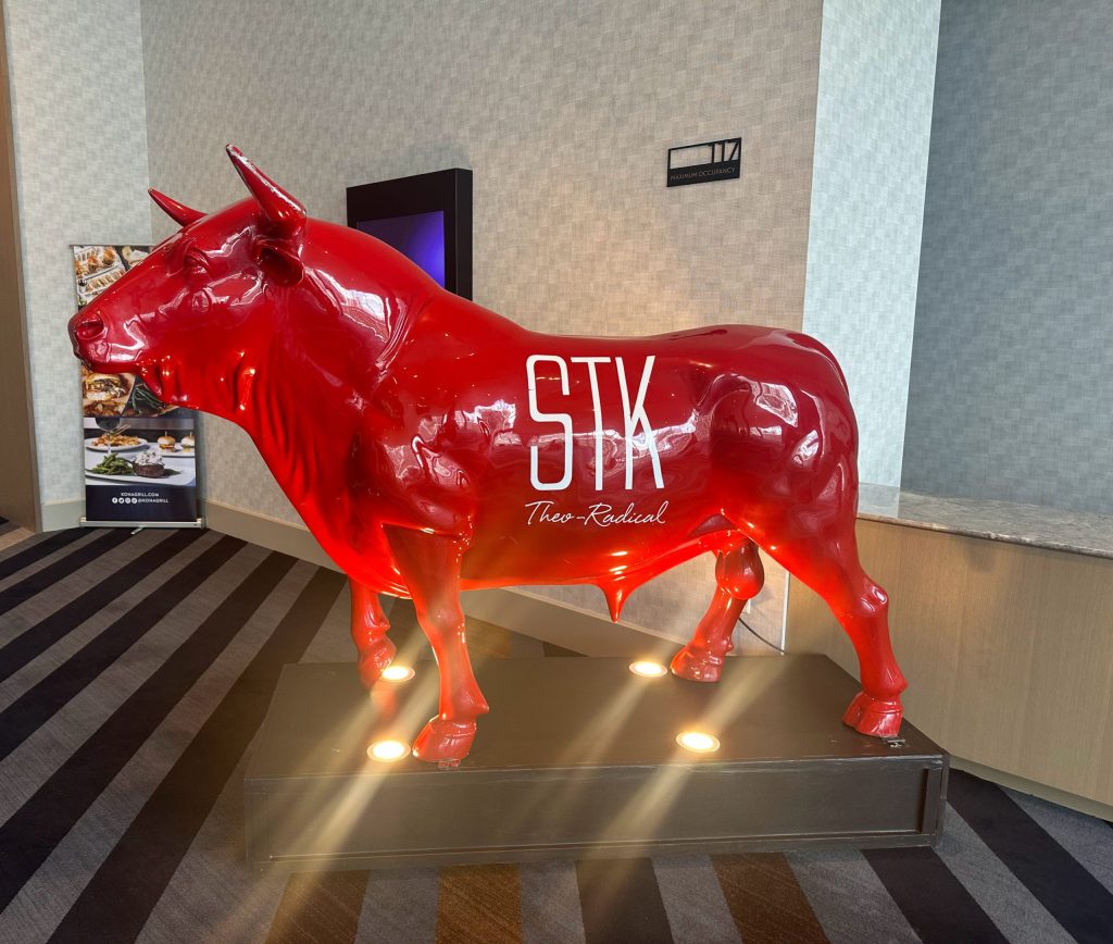 Red bull statue with the text 